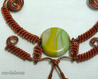 lampwork focal bead with copper , coiled wire elements