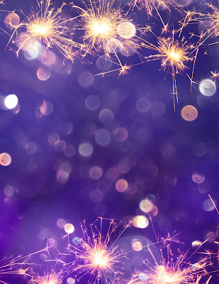 An image of bright lights against a deep purple background.