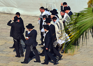 group orthodox jews approach wailing wall jerusalem