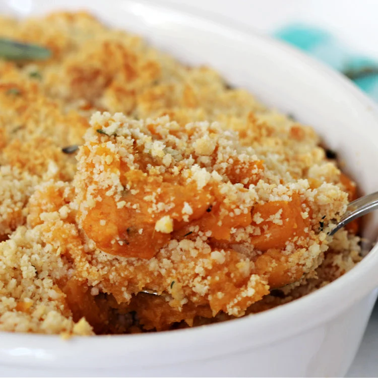 Spoonful of Easy Savory Sweet Potato Casserole ready to serve