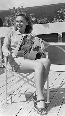 Lovely Miss Donna Reed catching some rays.