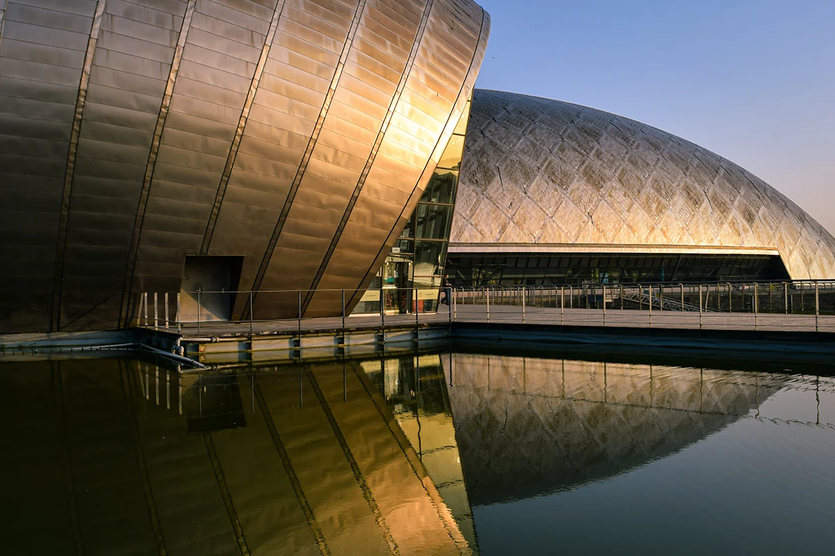 a side view at the Glasgow Science Centre in the evening