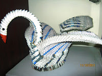 <img src="paper swan.gif" alt=" 10 ways to recycle old magazine pages" />