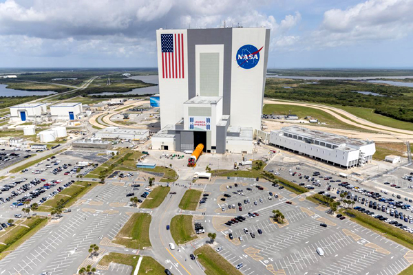 An aerial view of the SLS core stage booster for Artemis 1 being transported into the Vehicle Assembly Building at NASA's Kennedy Space Center in Florida...on April 29, 2021.