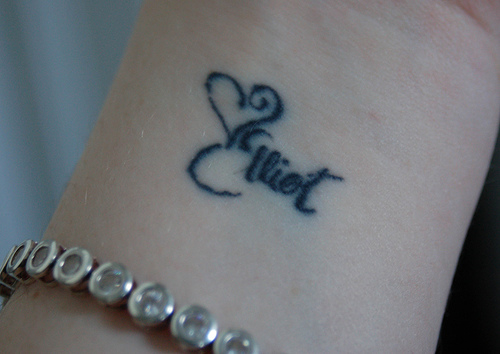 Heart tats with name can also be used as name wrist tattoo designs