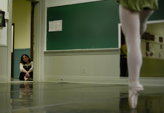 Tina Oates-Johnson watches her daughter rehearse ballet.