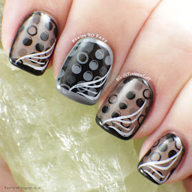 Monochromatic dotted and outlined nail art.
