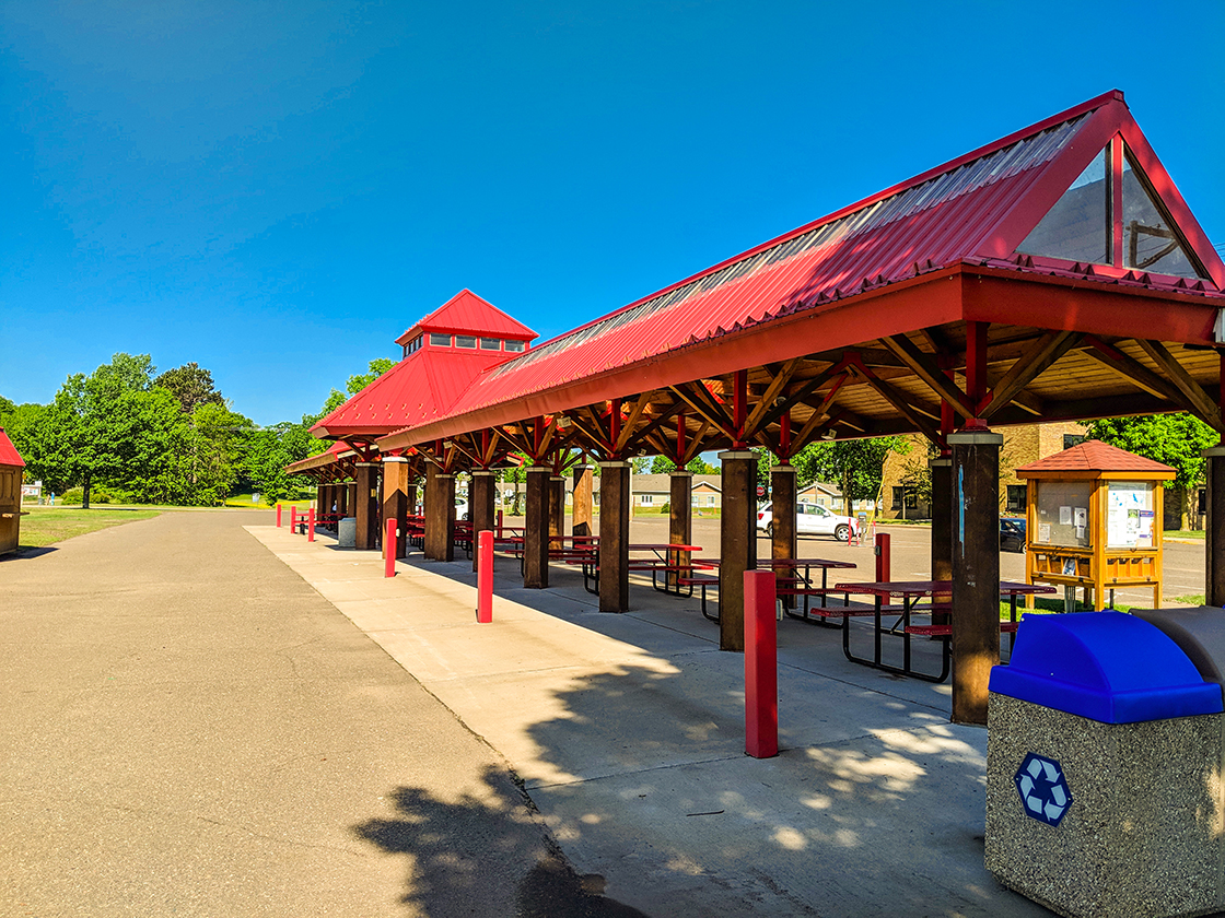Picnic shelter, kiosk, and parking lot in Amery at the beginning of the Stower Seven Lakes Trail