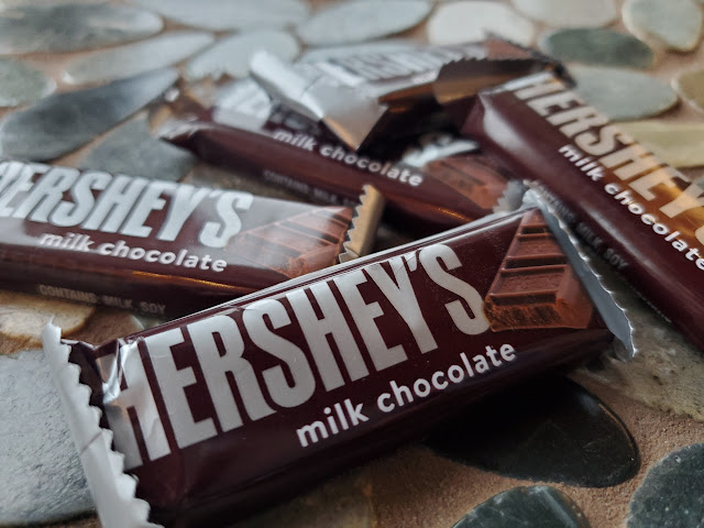 Image of five mini Hershey's bars on a stone table