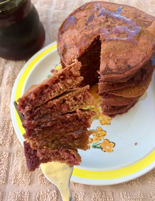 Fork full of beet pancakes.