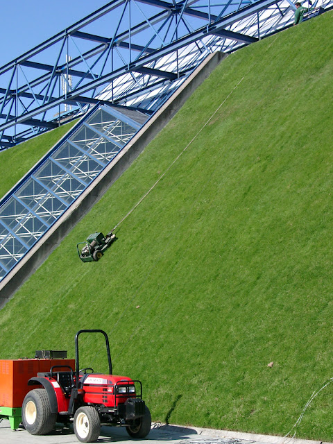 Slope mower at work, Palais Omnisports de Paris-Bercy, Boulevard de Bercy, Quartier de Bercy,  12th arrondissement, Paris