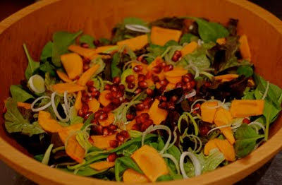 persimmon pomegranate salad with mixed baby greens