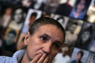 Esrefa Alic, a survivor of 1995 Srebrenica massacre, reacts to television coverage from the The International Court of Justice in an office in Tuzla February 26, 2007.