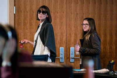 Movie still for the 2019 film Where'd You Go Bernadette where Cate Blanchett, wearing large frame sunglasses, walks out of her husbands office with her daughter, played by Emma Nelson