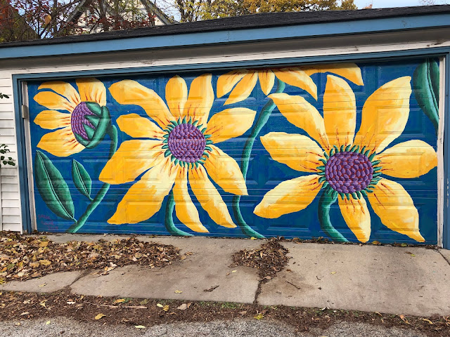 Bold sunflowers add cheer every day. Mural painted by artist Teresa Parod.