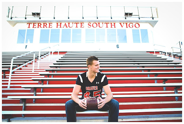 senior photos at high school football field