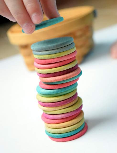 Dyed colored wooden discs for learning or playing