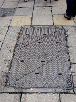 A manhole cover on Oxford Street, London