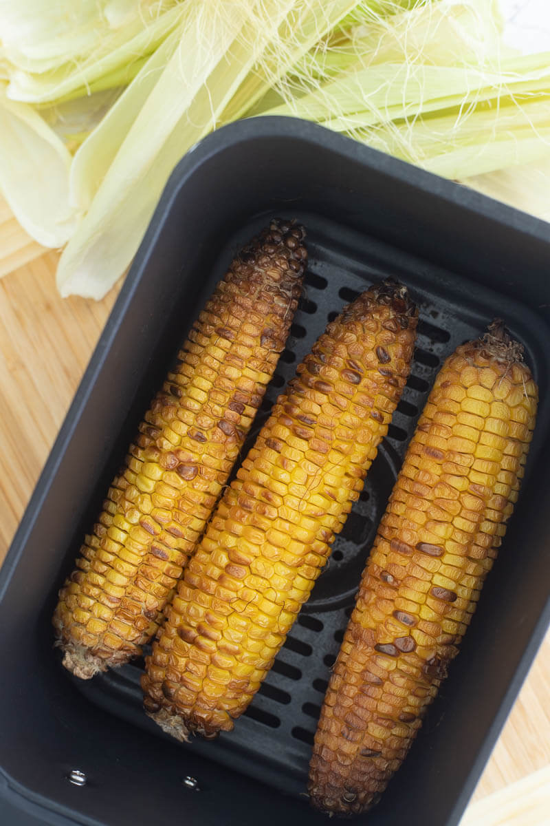 Roasted corn finished in the air fryer basket.