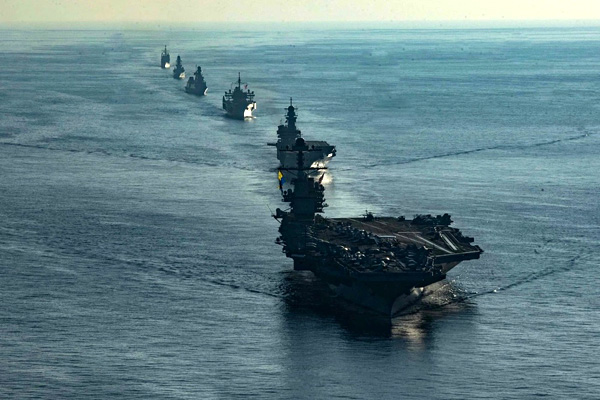 A file photo showing the aircraft carrier USS Gerald R. Ford being followed by fellow U.S. and Italian naval ships in the Ionian Sea...on August 20, 2023.