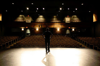 man on stage during software keynote