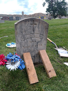 heastone repaired at Fairview Cemetery by members of Evergreen Heritage