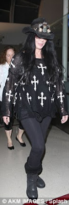 Cher cheerful at the Los Angeles Airport