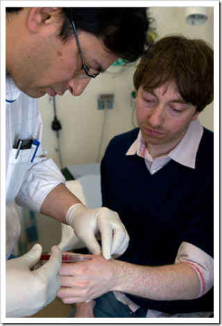 British scientist Dr. Mark Gasson getting a surgical implant in his left hand with an RFID microchip (March 16, 2009)