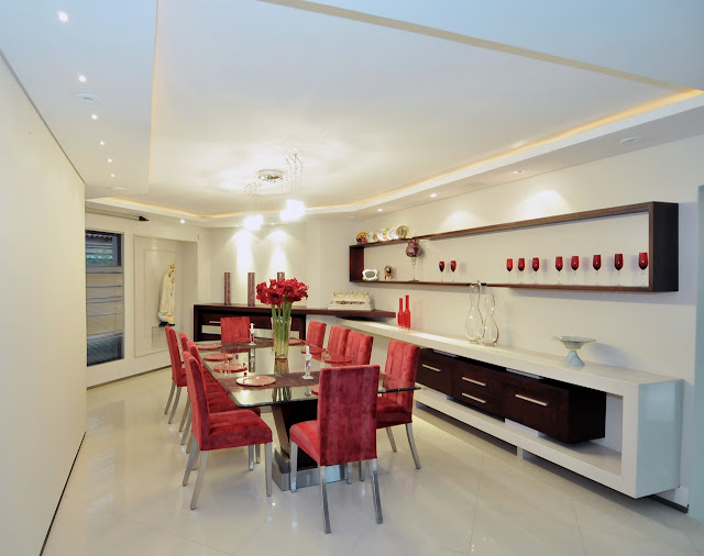 Dining room with red chairs 