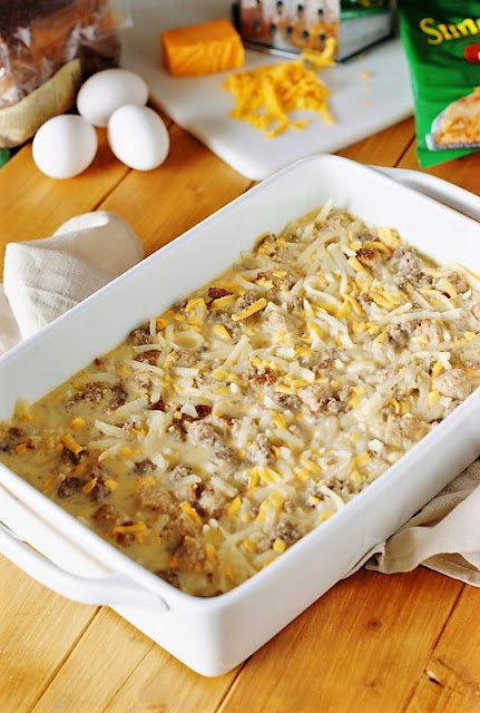 Preparing Overnight Sausage, Egg & Hash Brown Breakfast Casserole Image