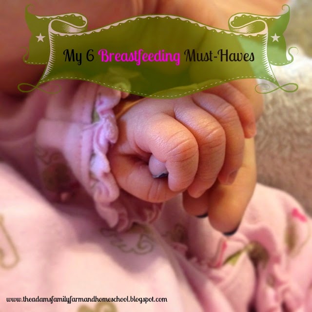 newborn hand holding finger