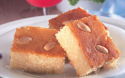 Basbousa is a semolina cake with almonds. It is drizzled with a syrup, making it not too sweet, but enough when it is served during ramadan dessert.