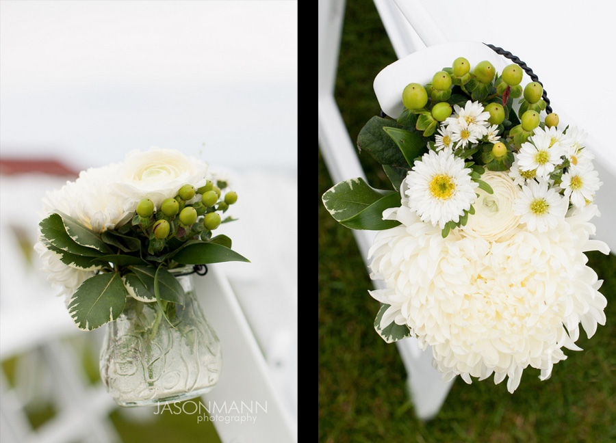 Small vases of white and green flowers lining the ceremony chairs. Door County lake wedding. Flowers by Flora. Photo by Jason Mann Photography, 920-246-8106, www.jmannphoto.com