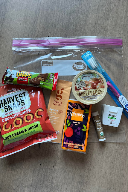 contents of a blessing bag on a wooden background.