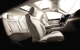 Interior shot of 2011 Lincoln MKS with cream leather interior and sunroof