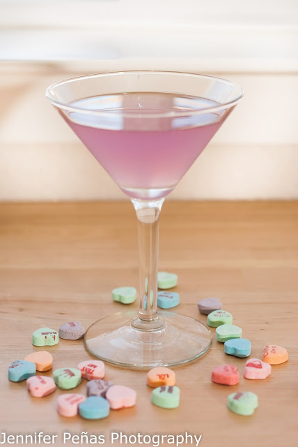 Cupid's Cup cocktail combines Hpnotiq Harmonie, vodka, cointreau and lime juice for a fun pink cocktail.