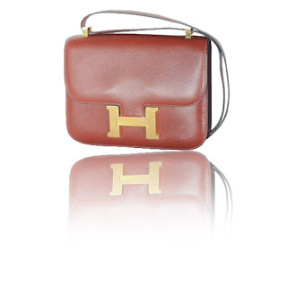 Vintage 1970's burgundy brown Hermes constance bag with gold "H" hardware.
