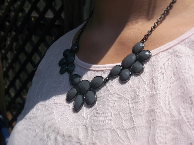  Pink lace tee, black and white patterned soft shorts, grey statement necklace, black sandals outfit outfit inspiration