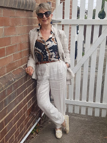 Thinking of Italy:  tan colour linen pants a blazer with multi-coloured blouse and a pair of loafers