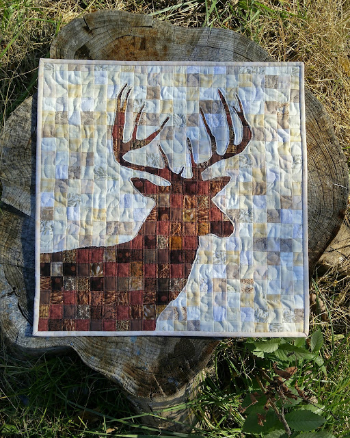 Reverse applique deer quilt