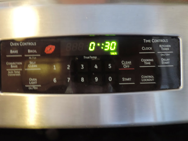 The stove timer set for 30 minutes.