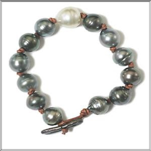 Tahitian pearls accented with a South Sea Pearl on knotted mocha leather