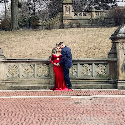 Well-dressed couple posing for photo outdoors