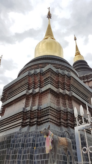 Statue of a zodiac animal next to a stupa. Wat Ban Den, one of the most beautiful temples in the northern part of Chiang Mai