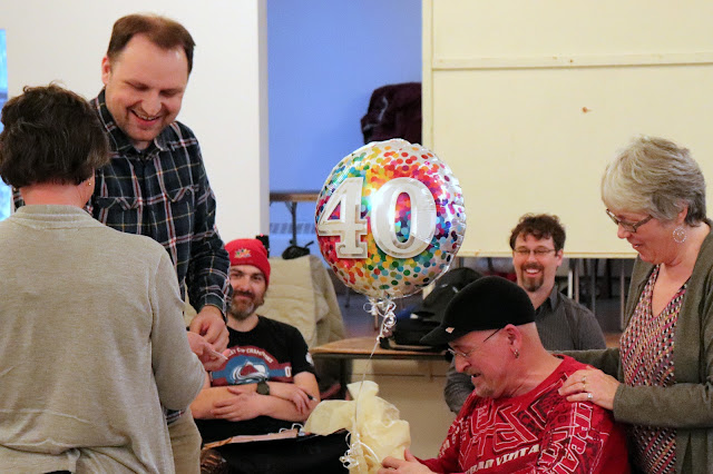 Christoph presents Pierre with a 40th tribute from the choir