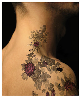 small flower tattoo. small flower tattoo