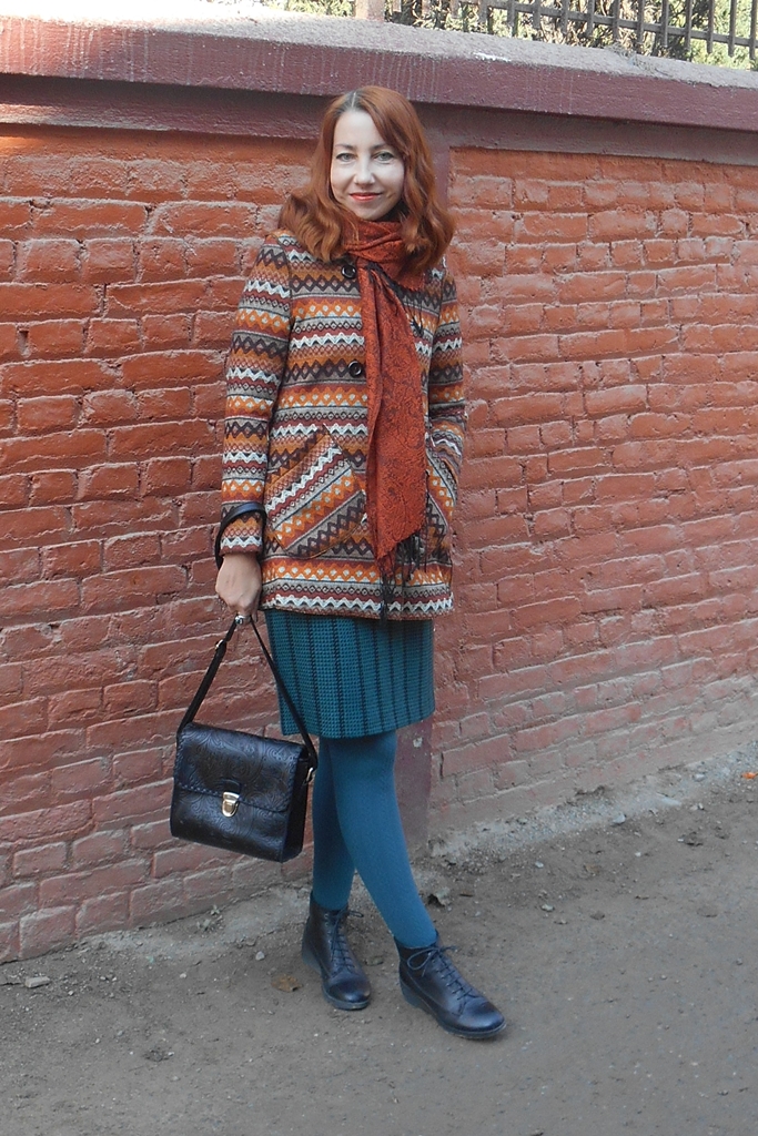 Printed coat with turquoise skirt and tights and copper scarf