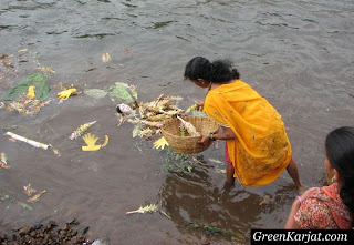 woman immersing gouri idol