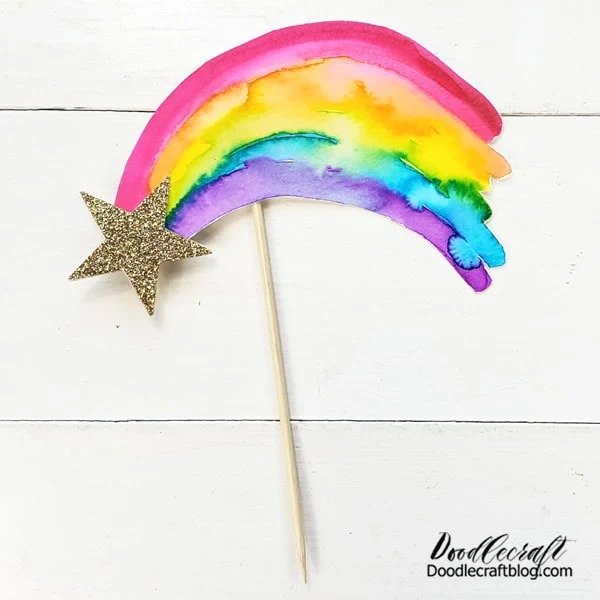 That's it! This cute watercolor rainbow cake topper is ready to decorate your party table! Stick it in a cake, a cookie, cupcake, brownie stack, pie, or even a sandwich for the perfect celebration!
