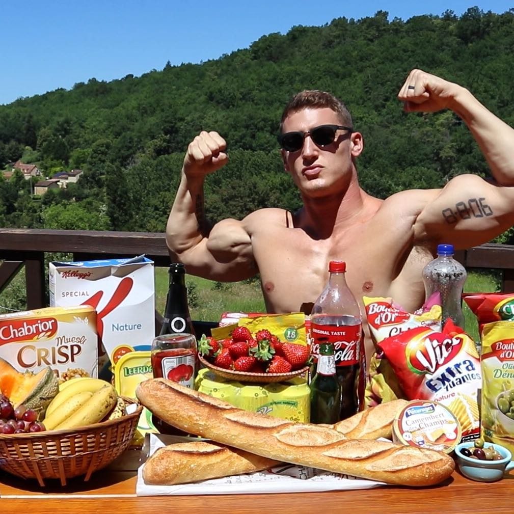 alpha-male-huge-biceps-flexing-food-table